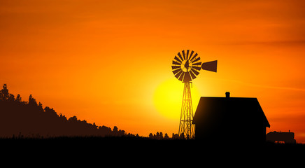 windmill, house and tractor at sunset. silhouette