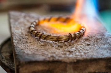 Craft jewelery making with flame torch