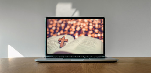 Worship from home, Online live church for sunday service, Laptop screen with cross and bible photo,...