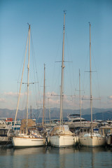 marina, yachts are on the water, sails are lowered