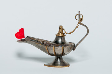 Fototapeta na wymiar oil lamp with heart symbol of love