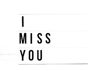 I Miss You flat lay on a white background. Love and relationship Vintage Retro quote board