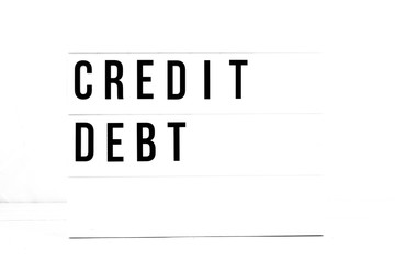 Credit Debt flat lay on a white background. Financial Awareness Vintage Retro quote board