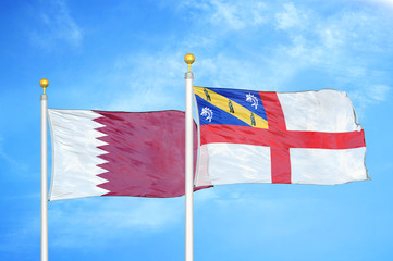 Qatar and Herm two flags on flagpoles and blue cloudy sky