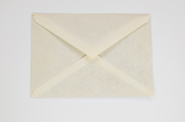 Old crumpled envelope on white background