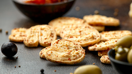 Cheese Palmiers with garlic, parmesan, grape, olives and chutney. party food snacks