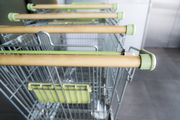 Empty shopping cart with dirty cart handle during coronavirus outbreak, risk to contaminated with...