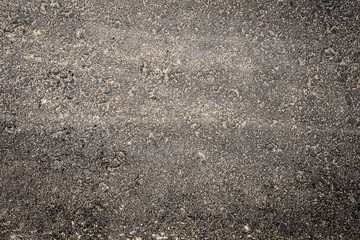 Asphalt road texture covered in sand