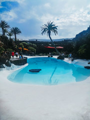 artificial pool, surrounded by greenery, in the canary islands
