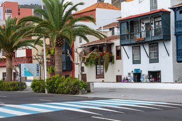 Famous ancient colorful balconies decorated with flowers. Santa Cruz - capital city of the island of La Palma, Canary Islands, Spain.