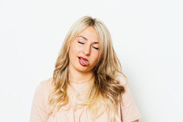 Naklejka premium Woman showing tongue