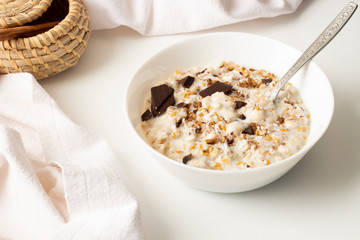 Healthy breakfast rich in grains. Bowl of porridge