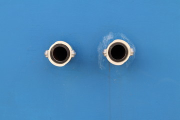 Drain pipe in the  blue wall.
