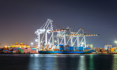 Container ships in the export and import business and logistics Deliver goods to the pier by crane...