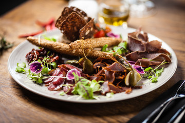 Meat platter for two served on a plate in restaurant