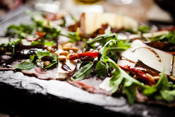 Beef carpaccio served on a board in restaurant