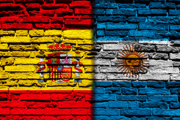 Flag of Spain and Argentina on brick wall