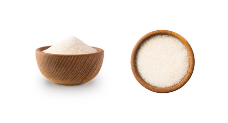 Heap of granulated sugar isolated on white background. Top view. Heap of sugar on white background. Wooden bowl of white sugar isolated on white background. Sugar in wooden bowl for cooking, isolated.