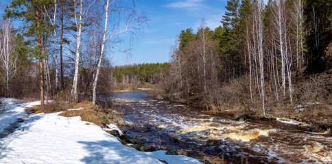 the spring of the Ural landscape with river and forest, Russia, April