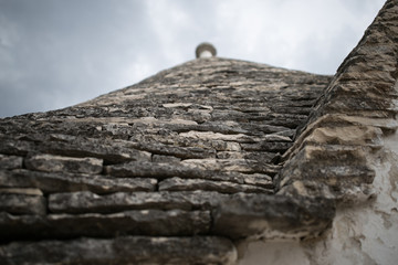 The beautiful white yards with a special houses of Alberobello in the southern part of Italy near...