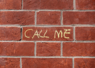 Call Me Graffiti on a Brick Wall - 335861539