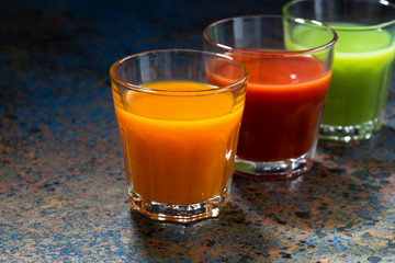 vegetable juices in glass beakers, horizontal