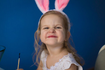 Girl paint easter eggs