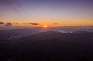 Forest and mountains silhouettes in sunset, Aerial, Poland ski resorts