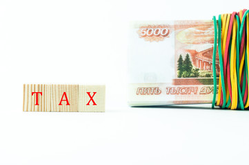 the inscription tax next to the banknotes of money