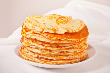 homemade russian thin tasty pancakes on the plate.