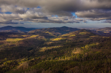 Naklejka premium Forest and mountains silhouettes in sunset, Aerial, Poland ski resorts