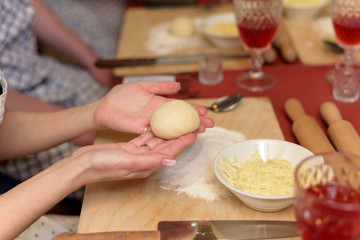 Girl shows a blank of dough for khachapuri