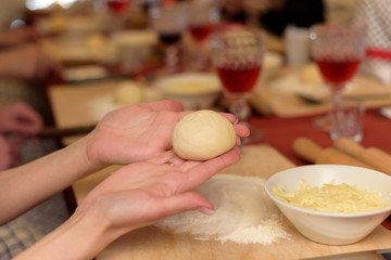 Girl shows a blank of dough for khachapuri