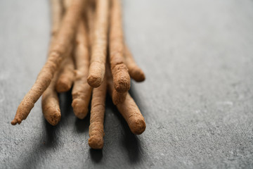 Traditional italian snack - grissini on concrete surface