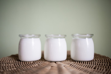 simplicity in design and eco-friendly packaging: glass jars with a dairy product