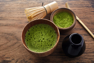 Set with green matcha tea on wooden background. Japanese tea ceremony. Food menu background. Tea ceremony set.