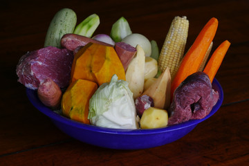 A isolated bowl of vegetables and meat ready to be cooked as a Portuguese Cozido.  - 335867776