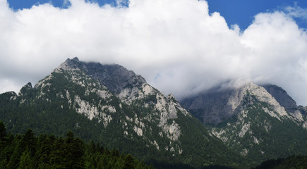 mountain peaks covered by clouds