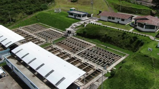 Aerial top view recirculation solid contact clarifier sedimentation tank, Water treatment plant Papallacta