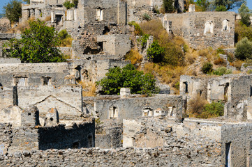 Fototapeta na wymiar Ruins at the former Greek village of Kayakoy in Turkey, abandoned 1922, now a museum and also known as the Ghost Town.