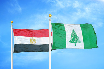 Egypt and Norfolk Island two flags on flagpoles and blue cloudy sky