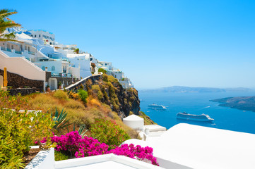 Fototapeta na wymiar White architecture and blue sea on Santorini island, Greece. Famous travel destination