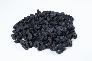 black raisins lies on a white background
