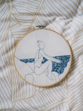 Embroidery frame girl sea waves