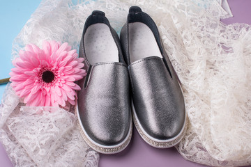 Beautiful elegant women's shoes, and a White drapery background.