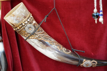 drinking horn on a red background