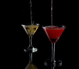 red cocktail on black background