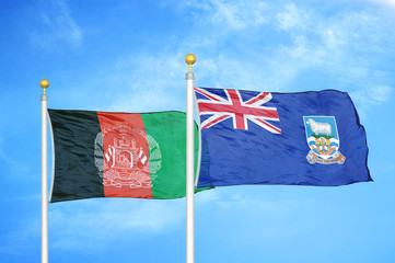 Afghanistan and Falkland Islands  two flags on flagpoles and blue cloudy sky