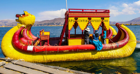 Peru Lake Titicaca typical straw boat departure