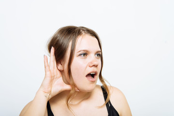 Overhears a woman, tries to listen.
